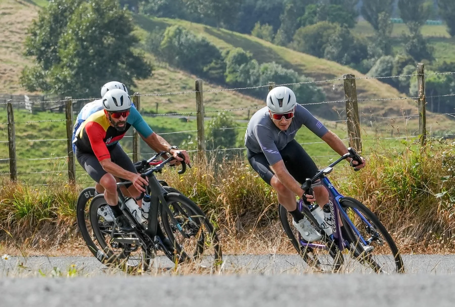Blair cycling coach descending a rural road on his road bike