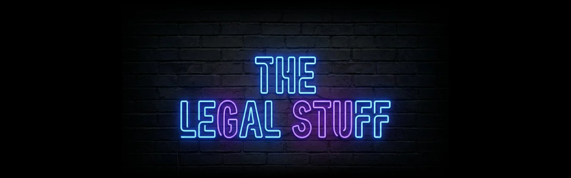Blue and purple neon sign on a dark brick wall displaying the text "THE LEGAL STUFF" for Huge Elite Clothing.