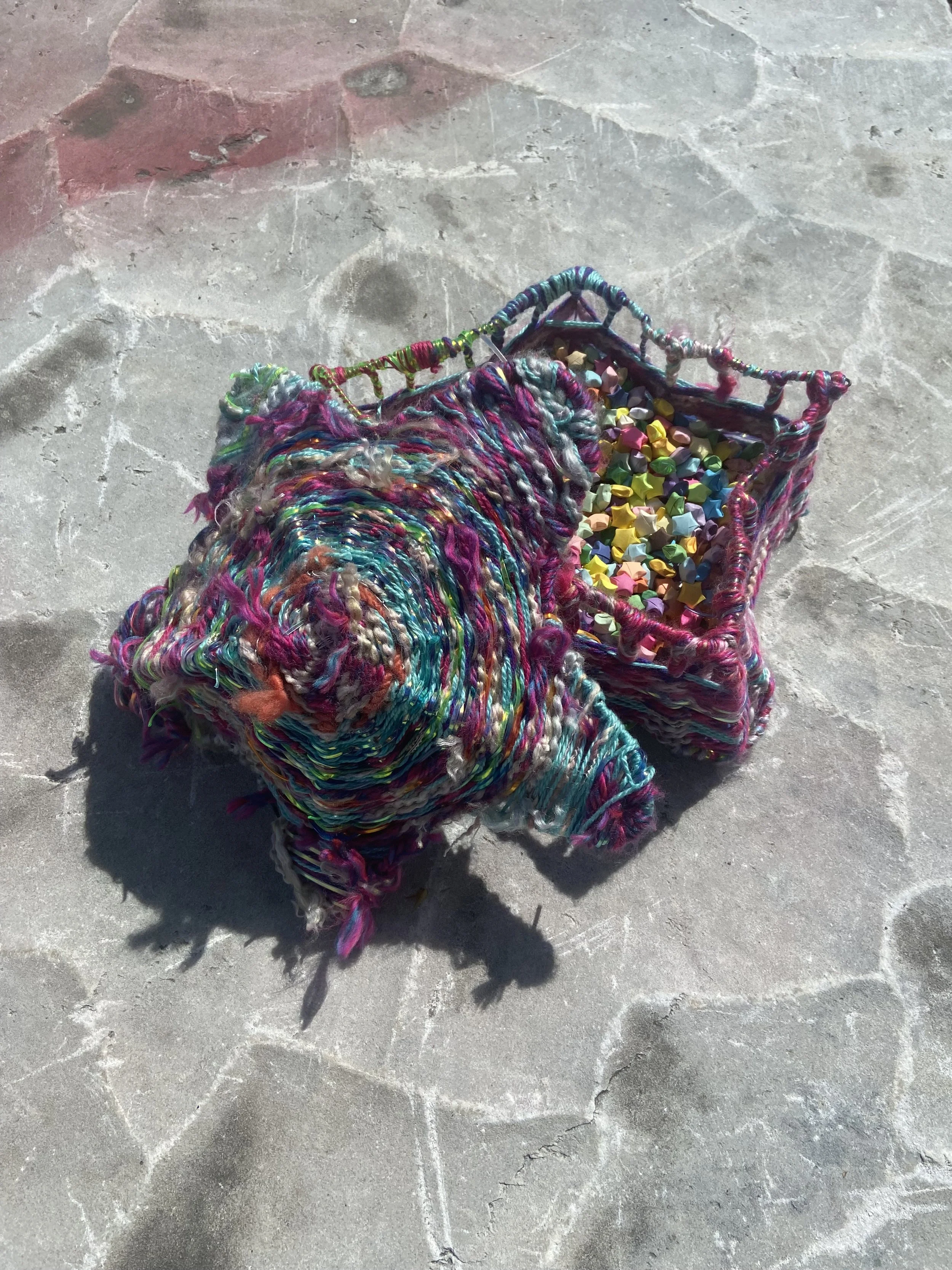 A Basket of Wishes, 2024, wire, yarn, lanyard string, origami stars