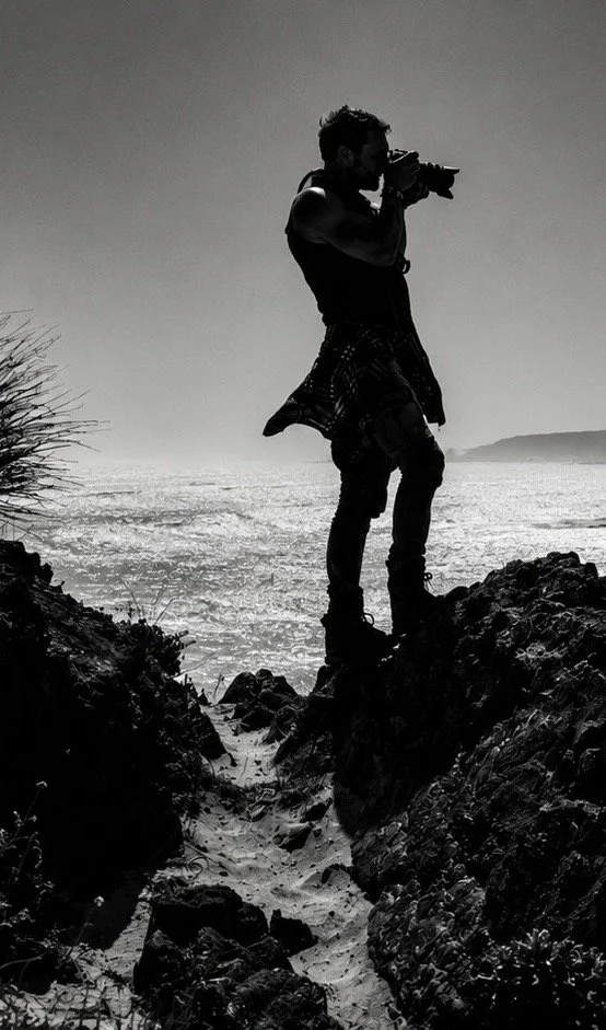 Sébastien Cros, founder of WeTravelAustralia, photographing the coast of Kangaroo Island, South Australia. Black and white.
