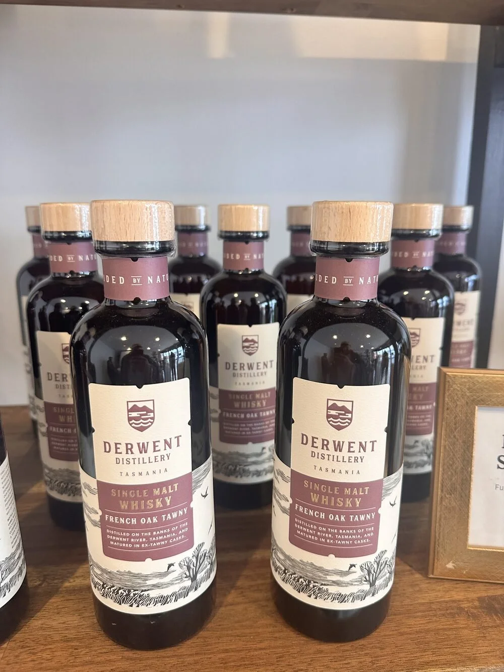 Single malt whisky bottles at Derwent Distillery, Tasmania, matured in French oak tawny casks.