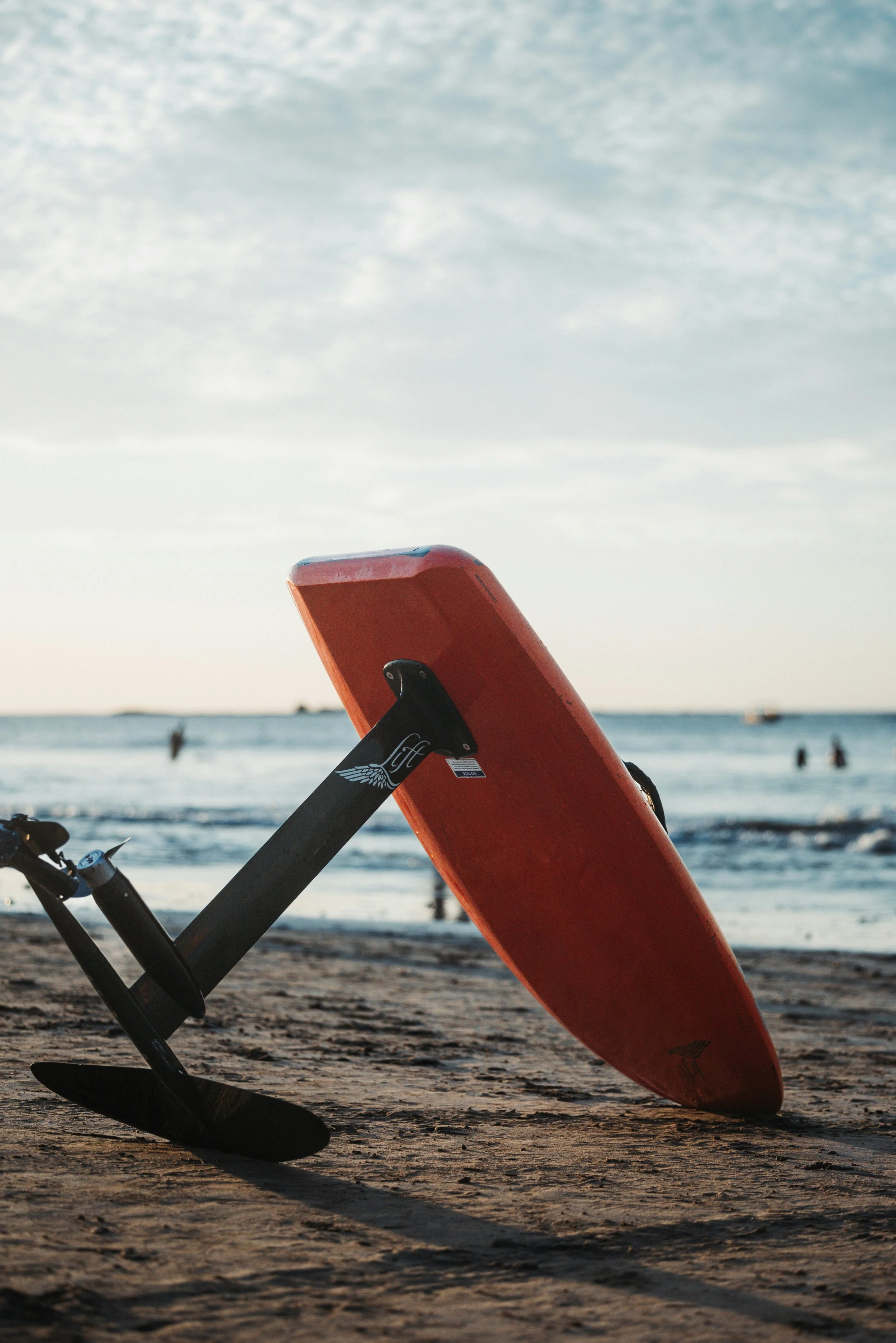 Luxury yacht water toys: person using an eFoil surfboard during a private charter.