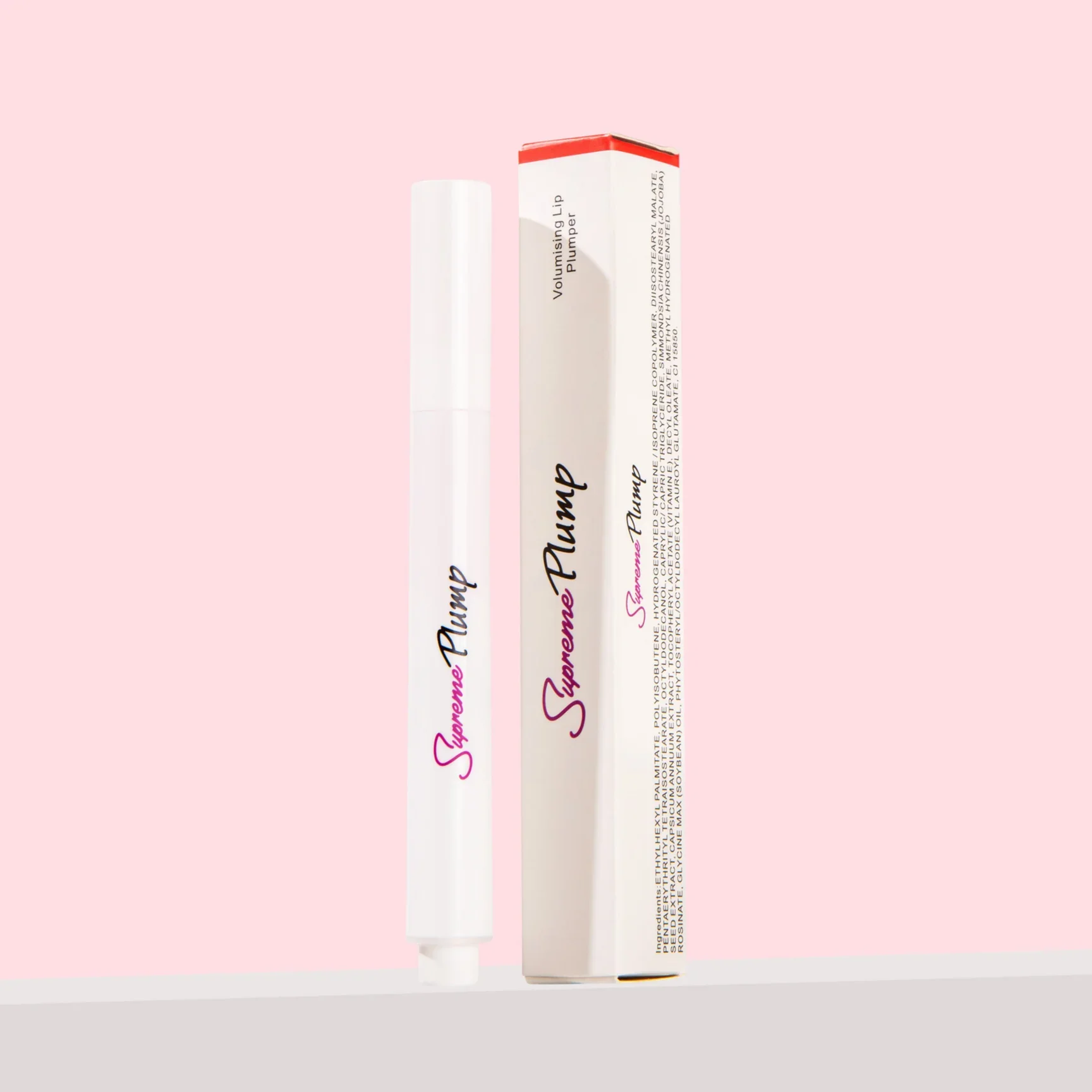 A white lip plumper tube next to its box on a pink background.