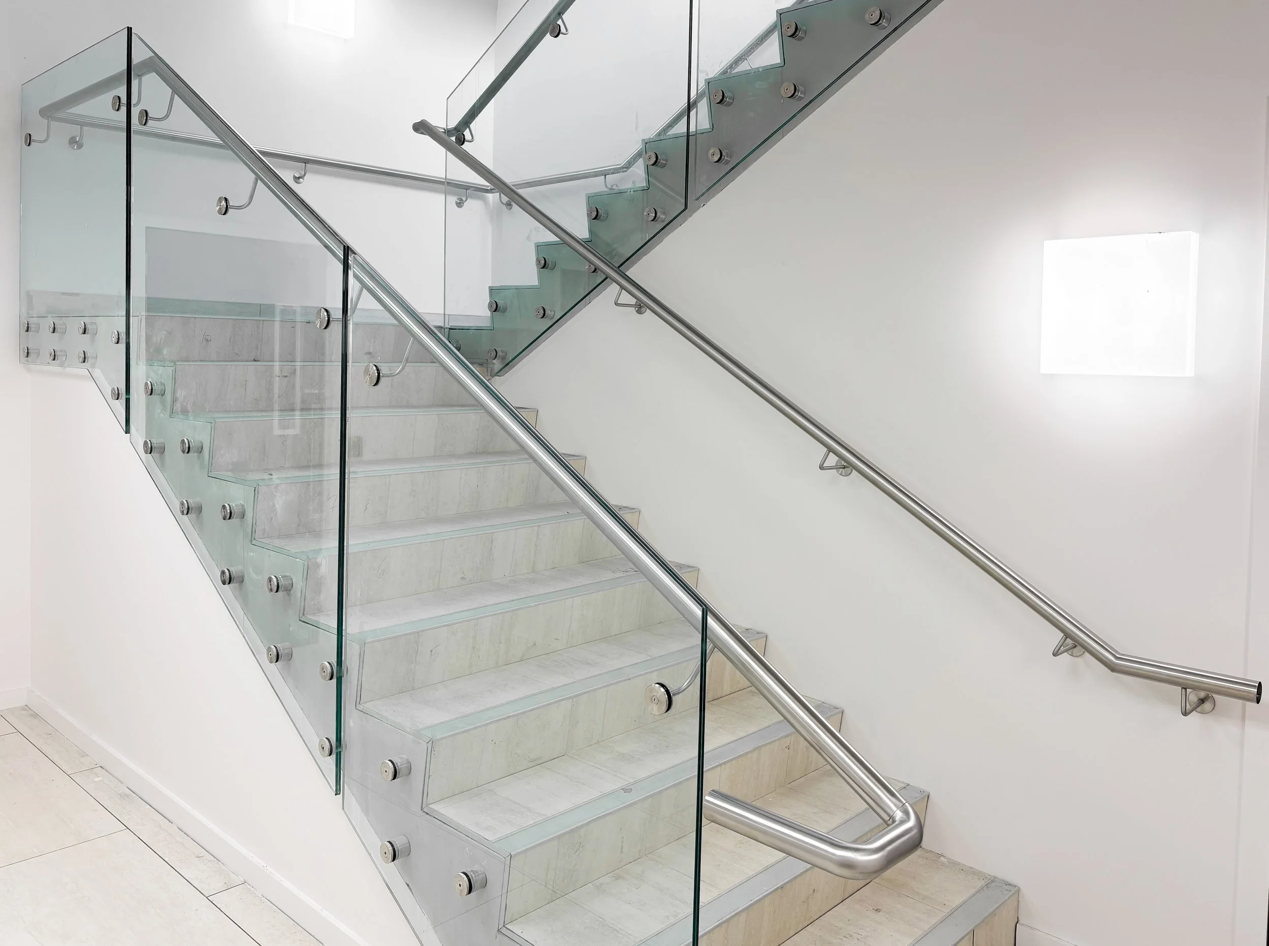 Stainless steel handrail on glass