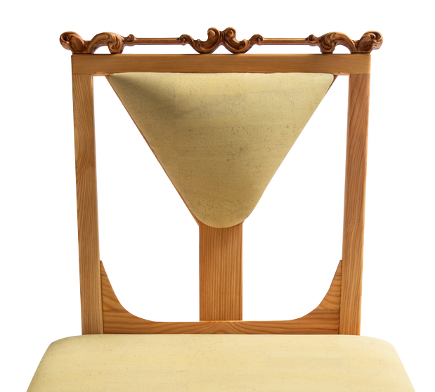 Close-up of a wooden cat missing chair with a scratched beige cushion.