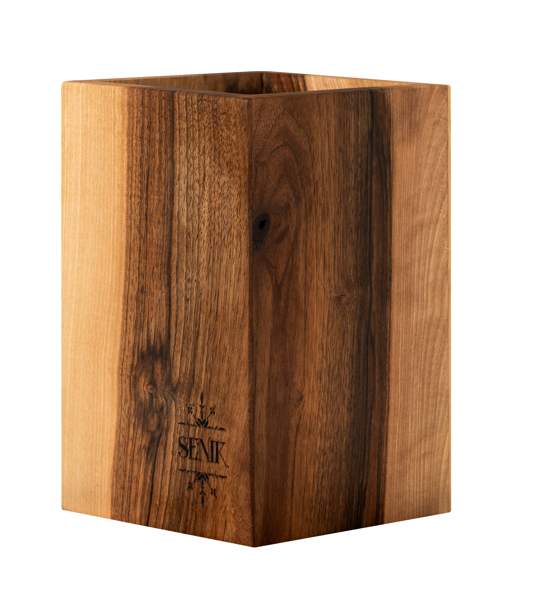 Close-up of a wooden block with engraved text and symbols, including the word 'SEMIK' and a geometric logo.