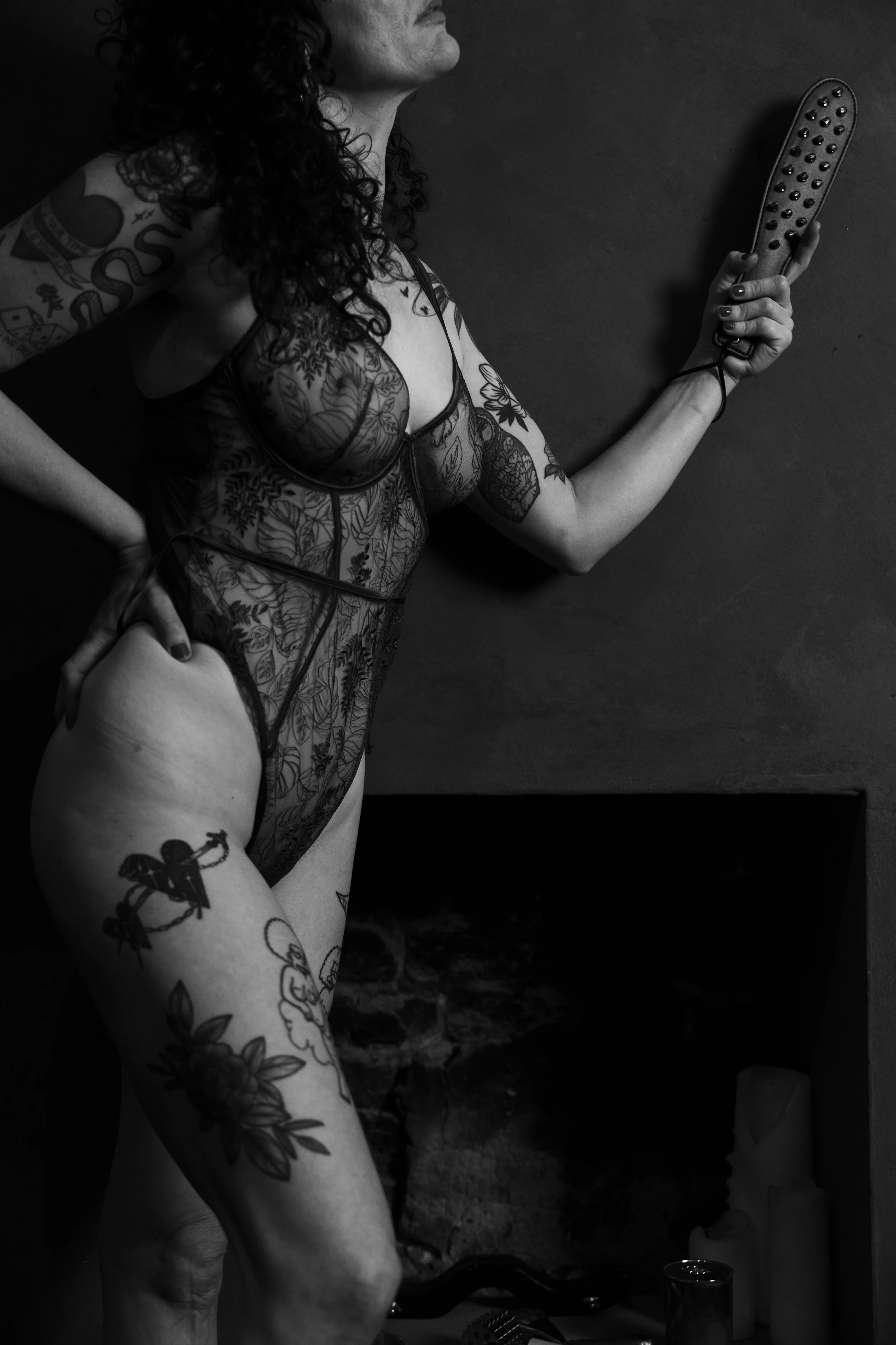 Close-up of Celine syn, London GFE companion and independent BDSM escort  Lacy lingerie and stylish wooden panel,