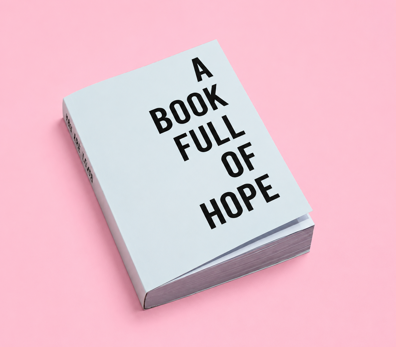 Smyckegård Coaching home-page picture, on illustrative purposes a picture of a book titled 'A Book Full of Hope' resting on a pink surface.