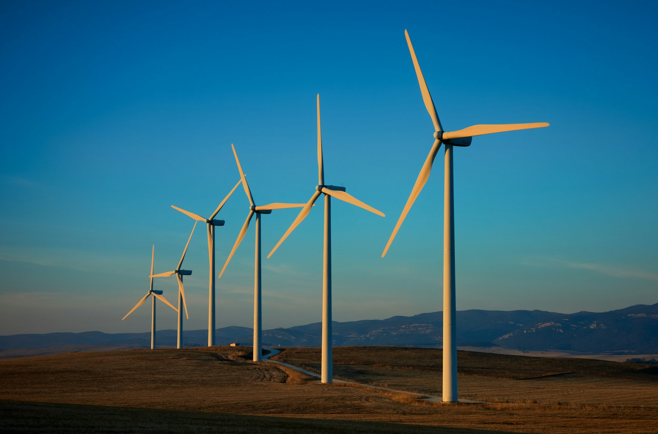 Why does the debate over wind turbines continue?