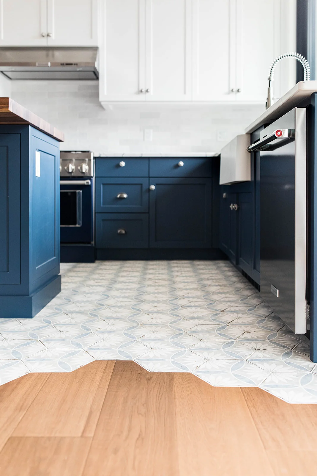 Custom kitchen tile with blue cabinets installed in Trail, BC