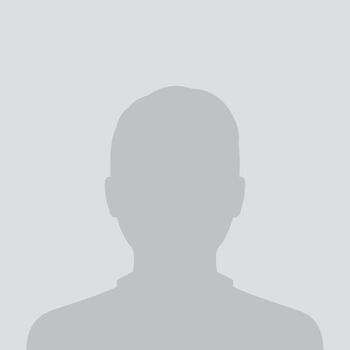 Silhouette of a person against a plain background.
