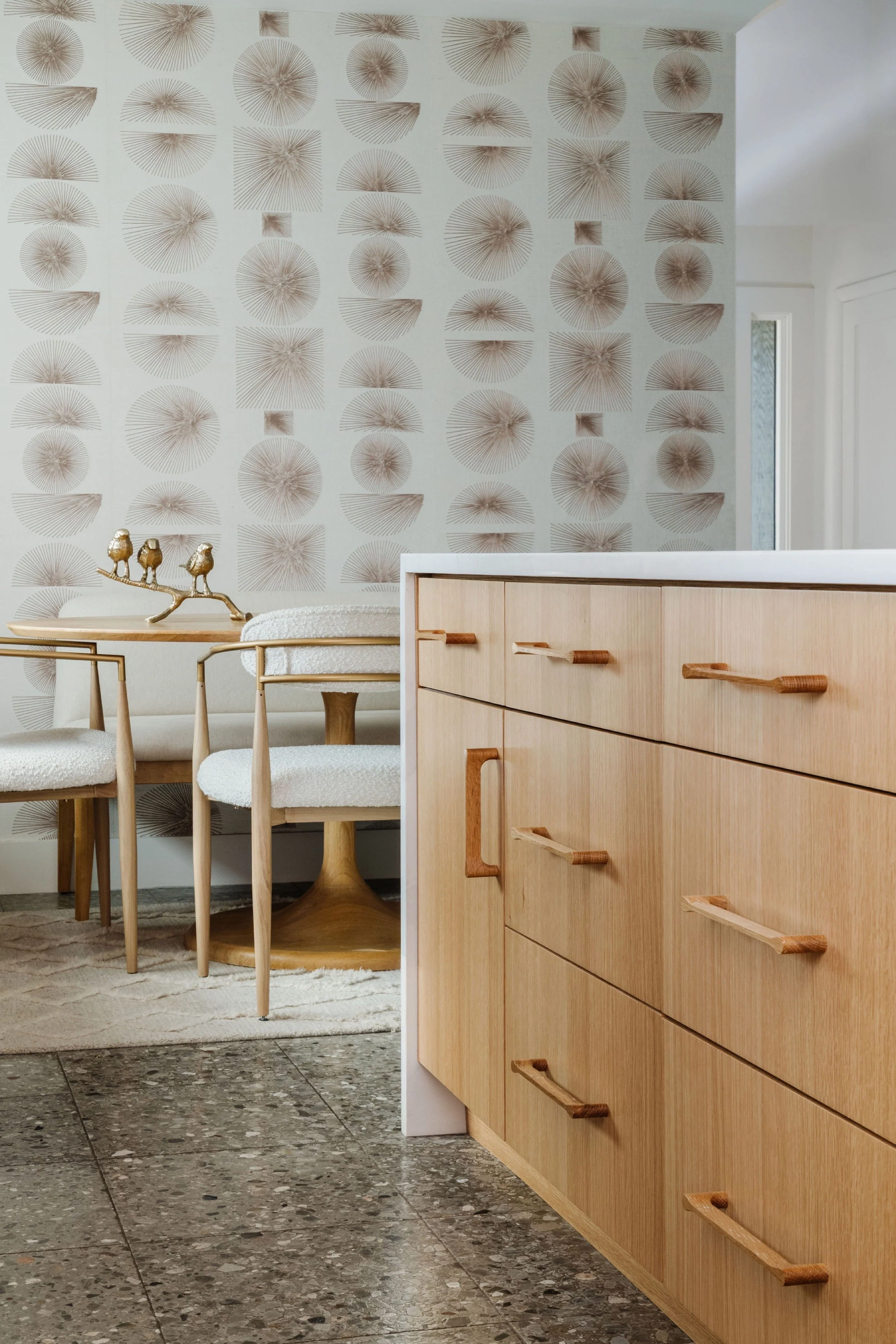 A photo of a kitchen with wooden cabinets and a white countertop with "Cabinetry" text overlay