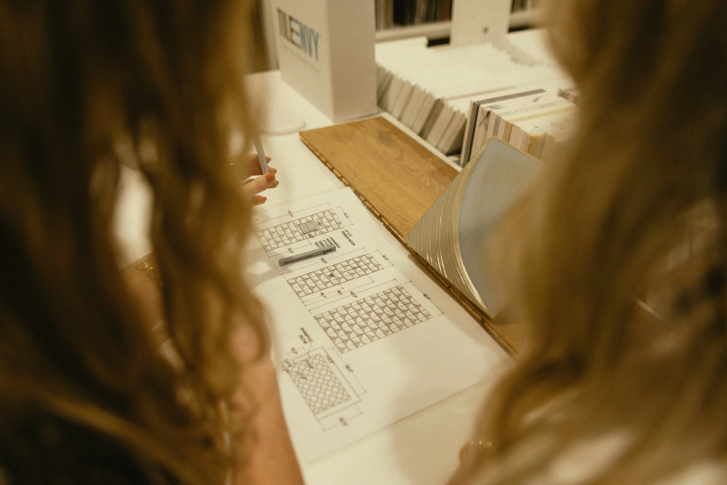 Two team members looking at a floorplan