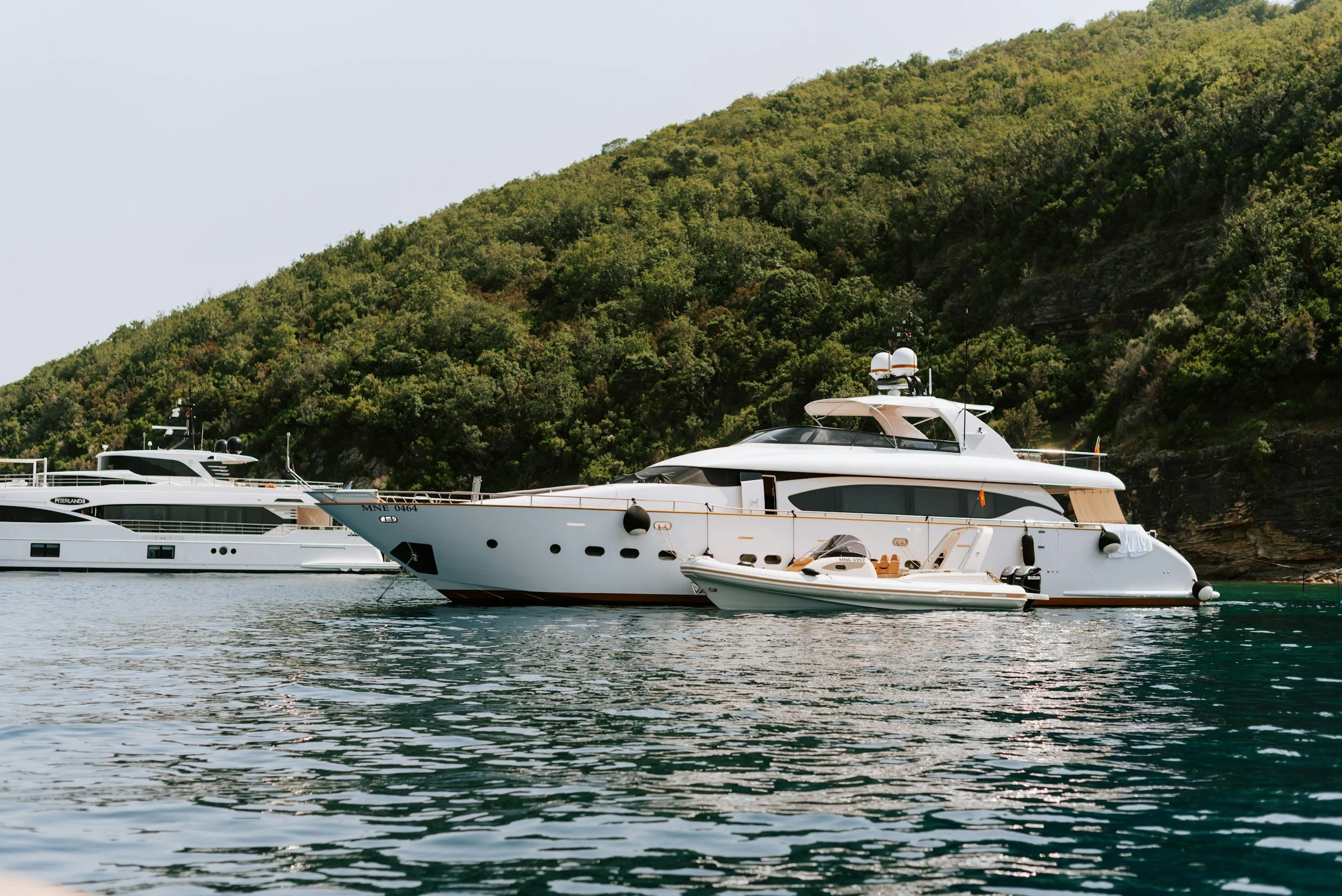 yacht and rib on island