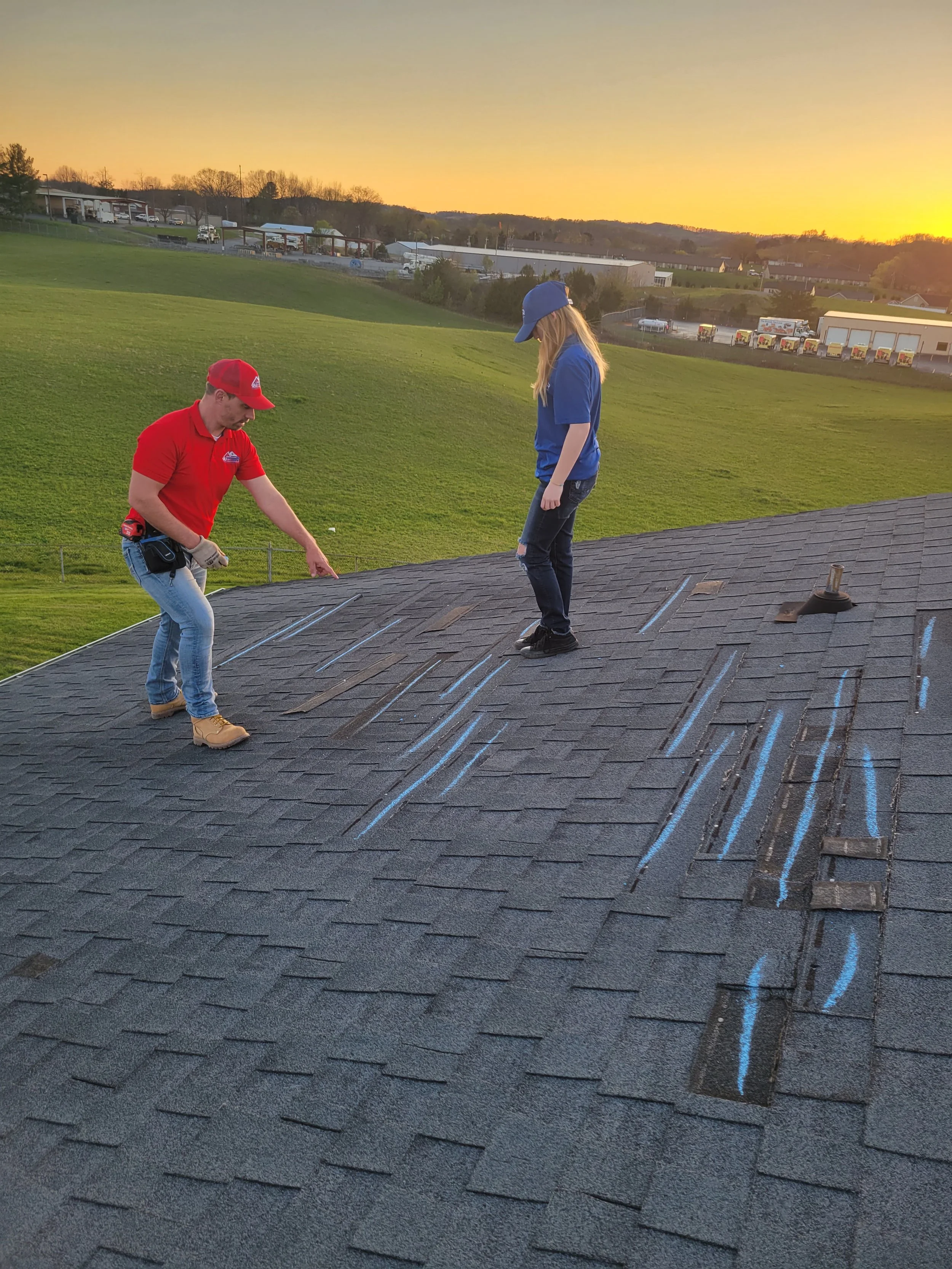 Armor Exteriors technicians inspecting roof conditions during a residential property assessment in Upstate South Carolina.