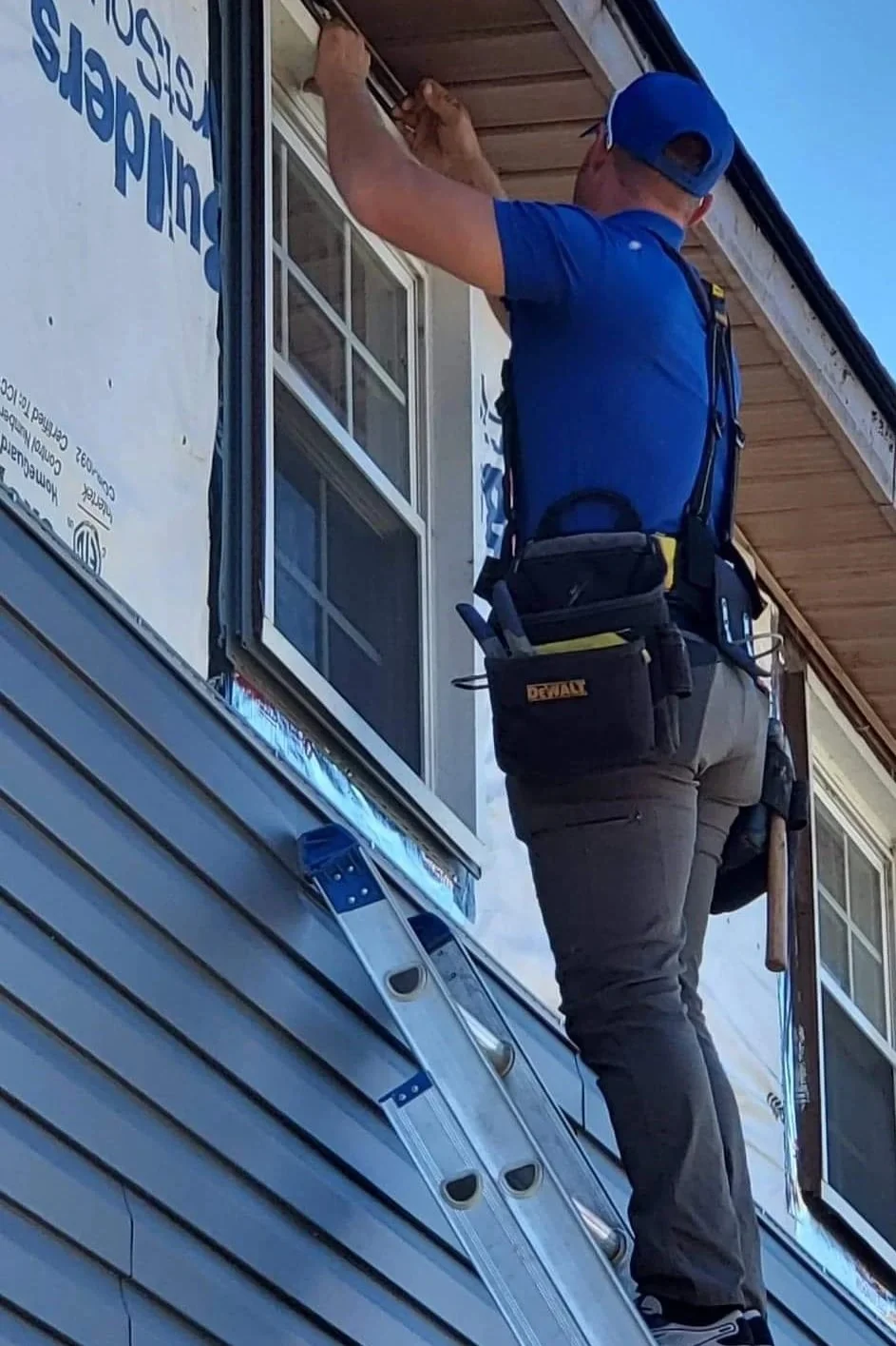 Armor Exteriors technician waterproofing a window before siding installation on a home in Upstate South Carolina.