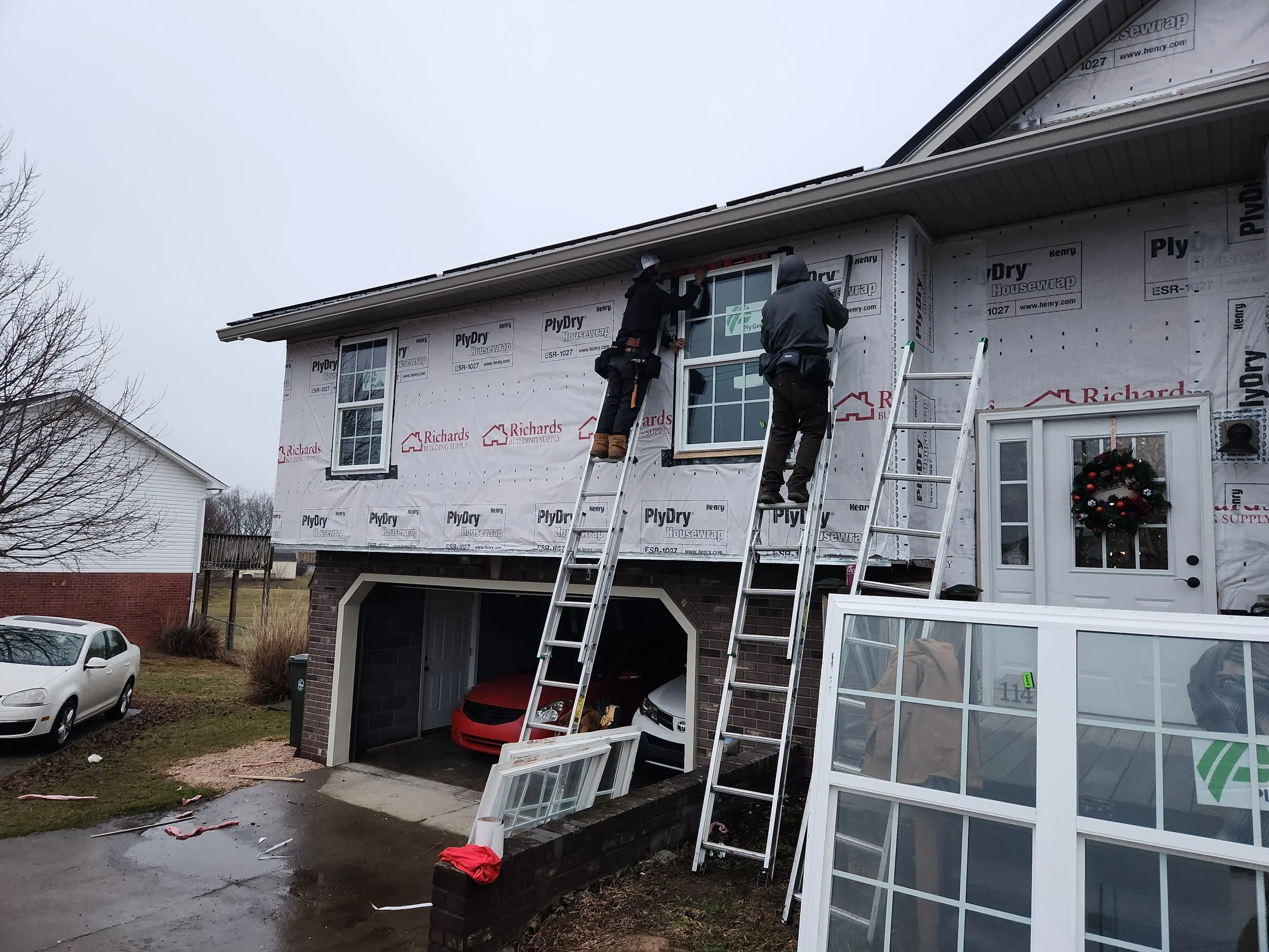 Armor Exteriors technicians performing siding and window exterior work on a residential home in Upstate South Carolina.