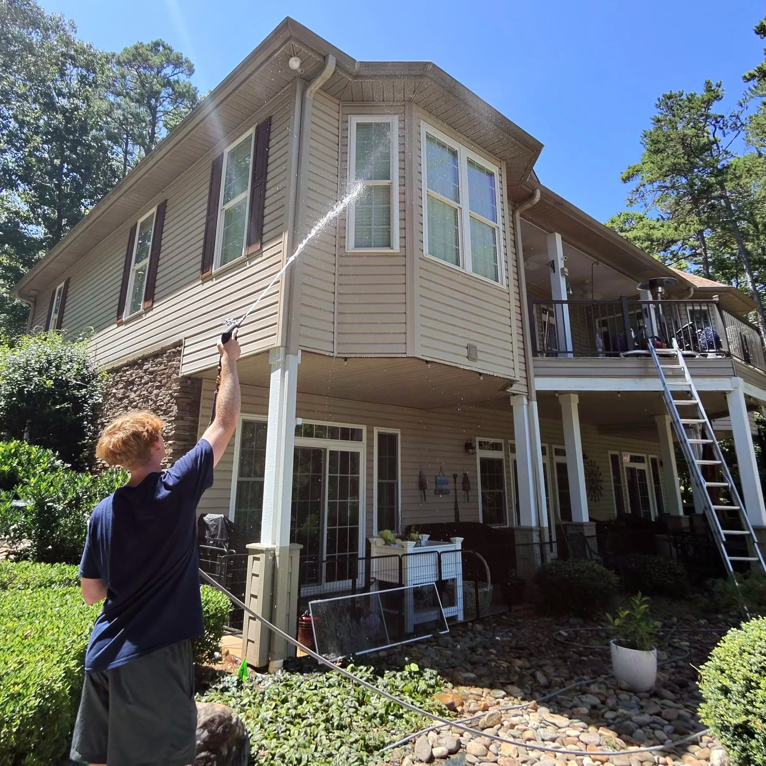 Armor Exteriors technician washing the exterior of a home in Seneca, South Carolina.