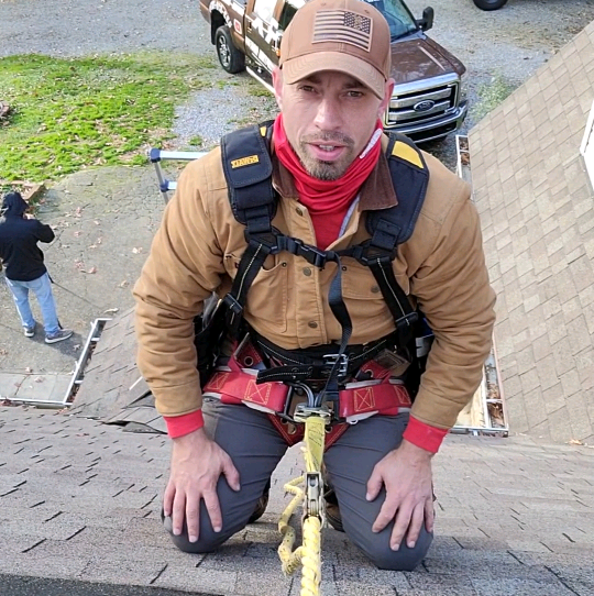Armor Exteriors technician performing preventative roof maintenance on a home in Seneca, South Carolina