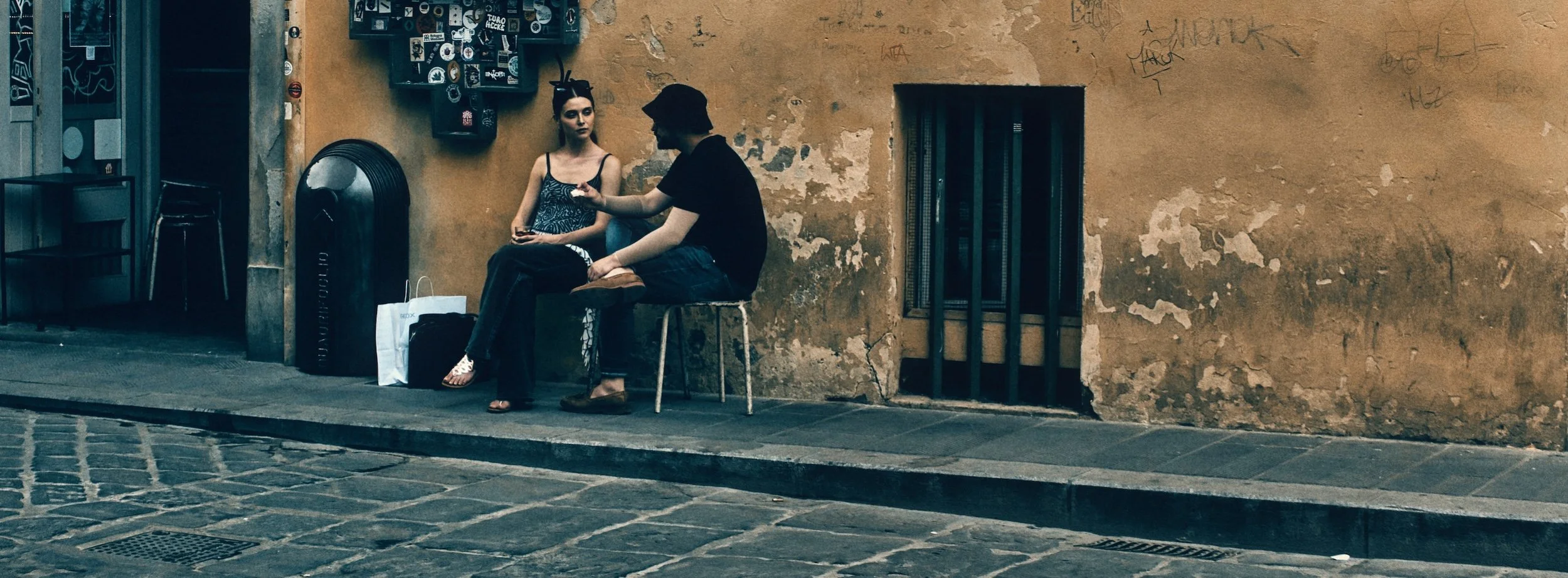 Street photograph, Florence 2024. 65x24 wide panoramic format.