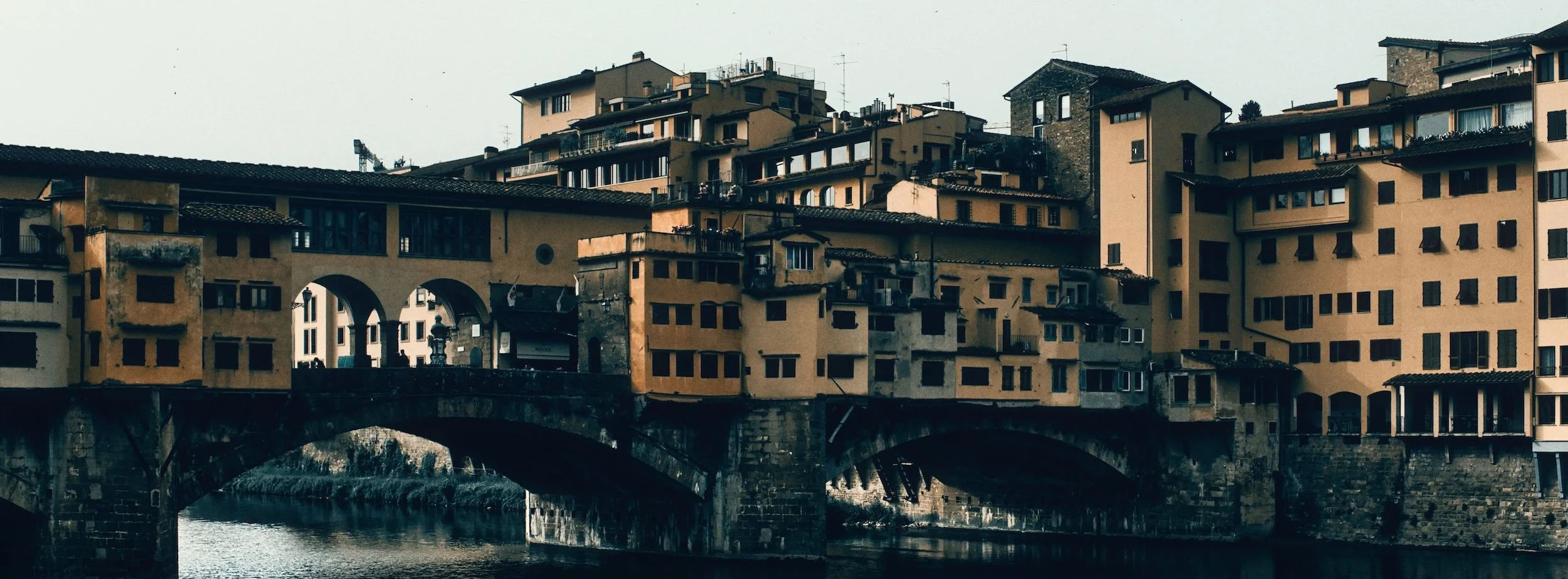 Street photograph, Florence 2024. 65x24 wide panoramic format.