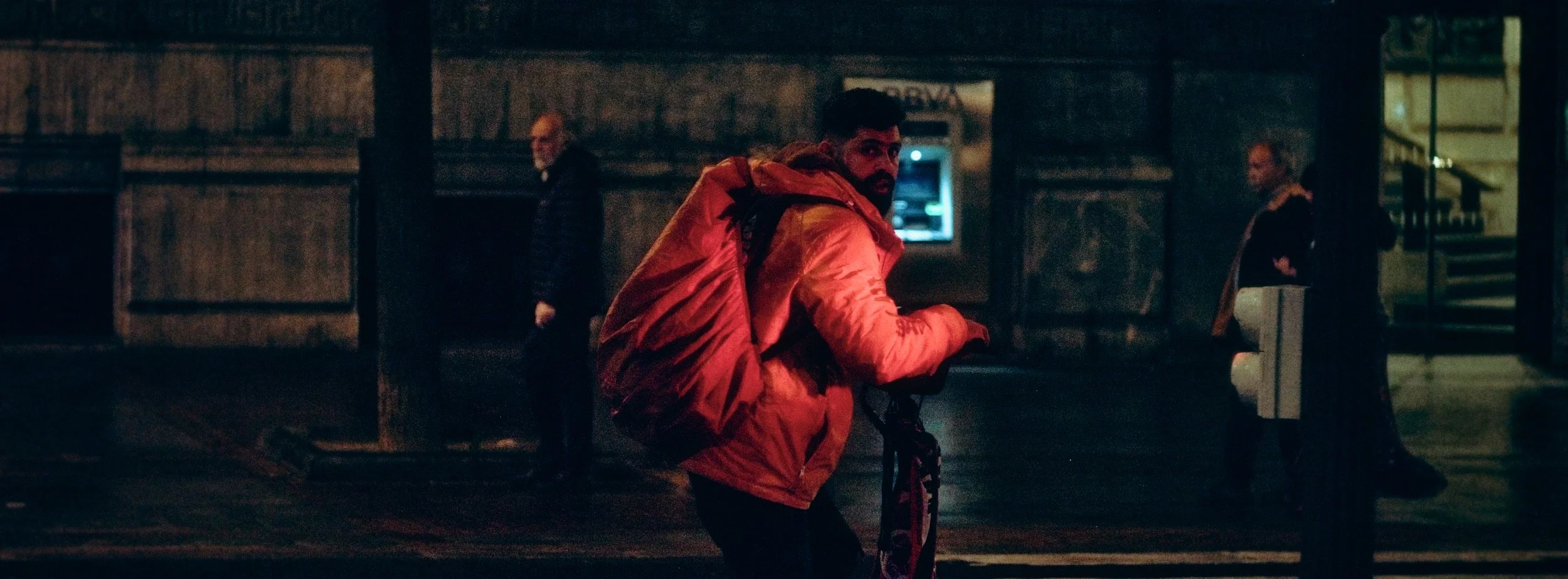 Street photograph, Bilbao, 2025. 65×24 wide panoramic format.