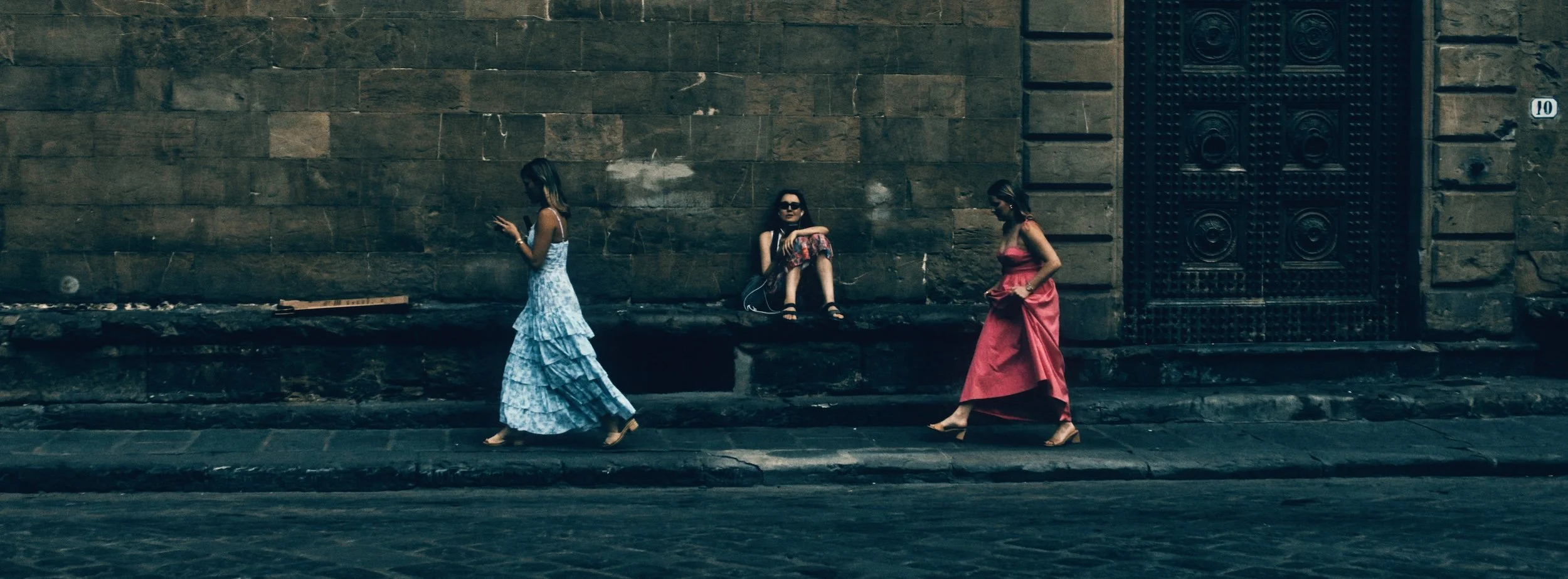 Street photograph, Florence 2024. 65x24 wide panoramic format.