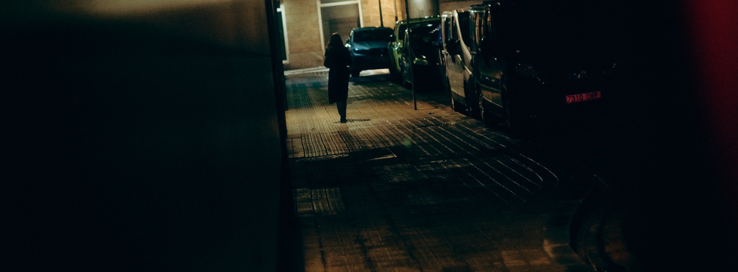 Street photograph, Bilbao, 2025. 65×24 wide panoramic format.