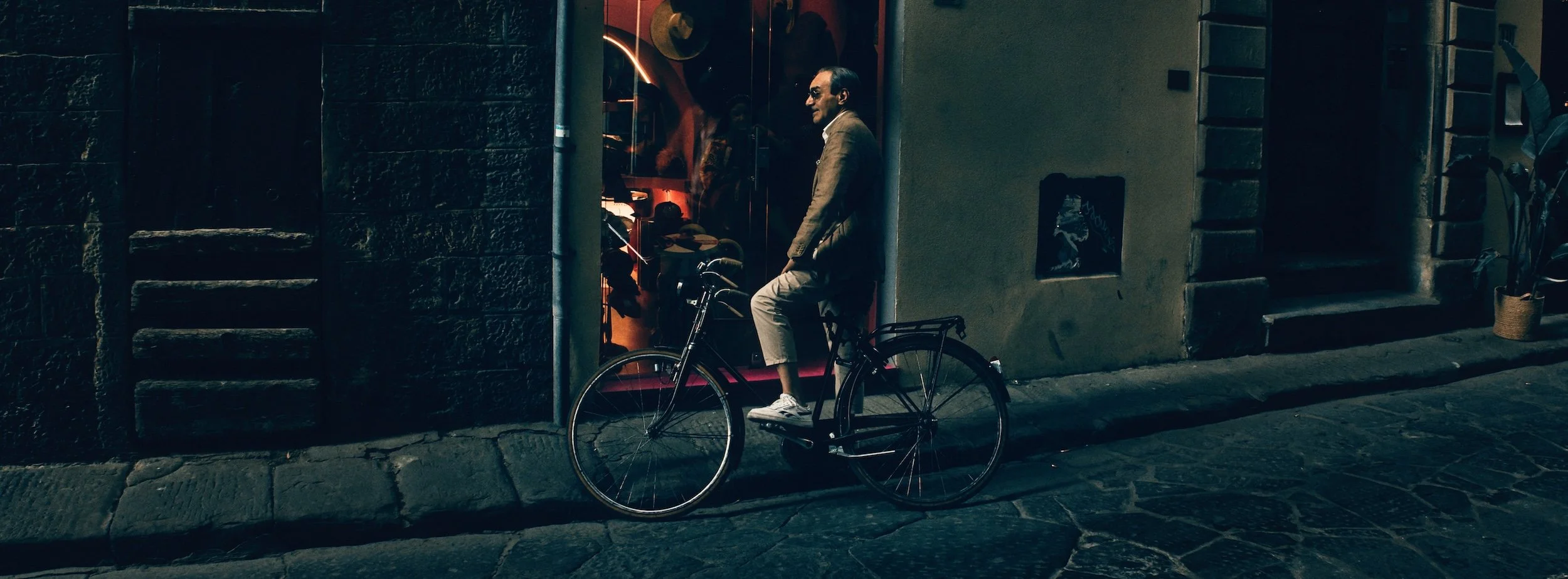 Street photograph, Florence 2024. 65x24 wide panoramic format.