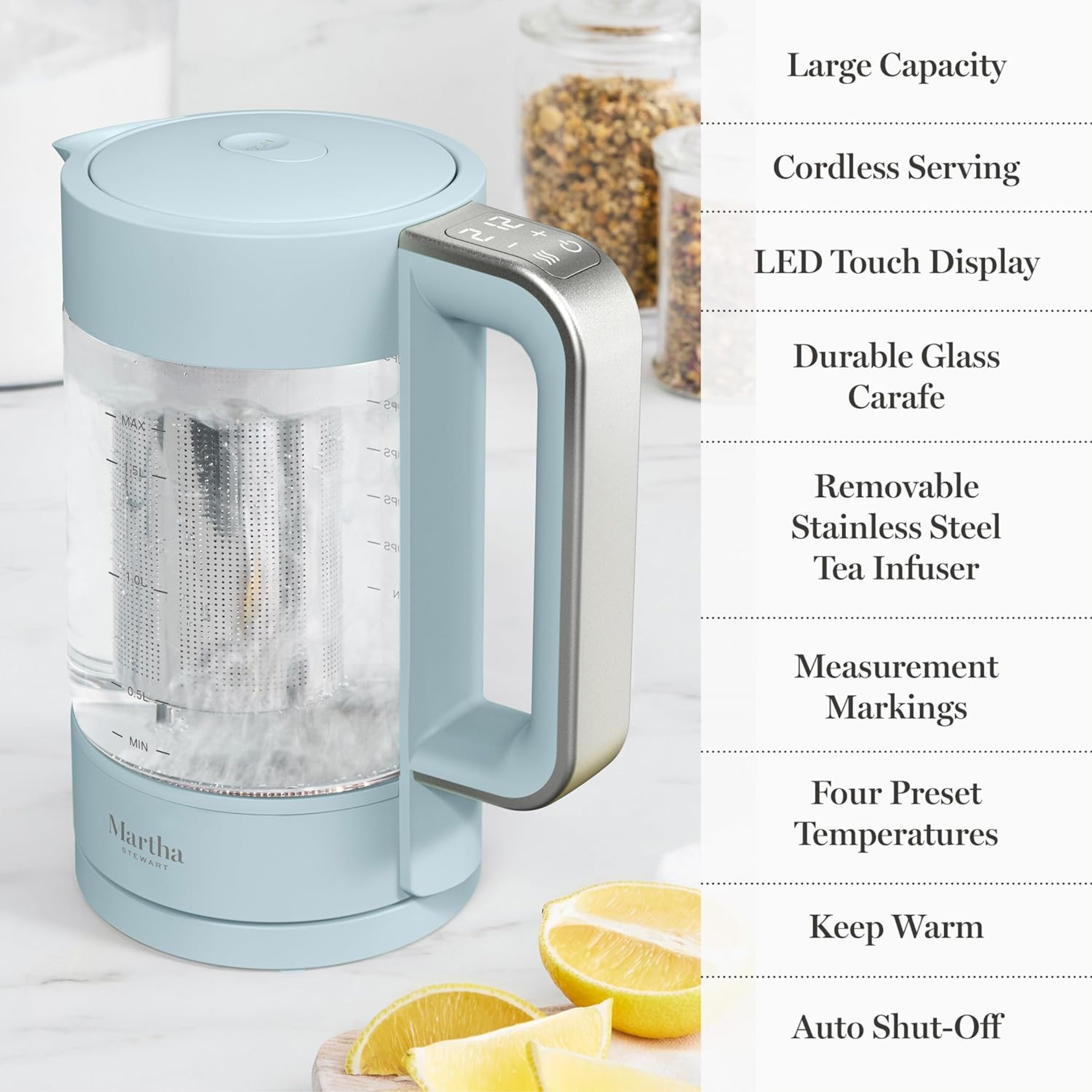 A minimalist pale blue-colored electric kettle by Martha Stewart on a countertop