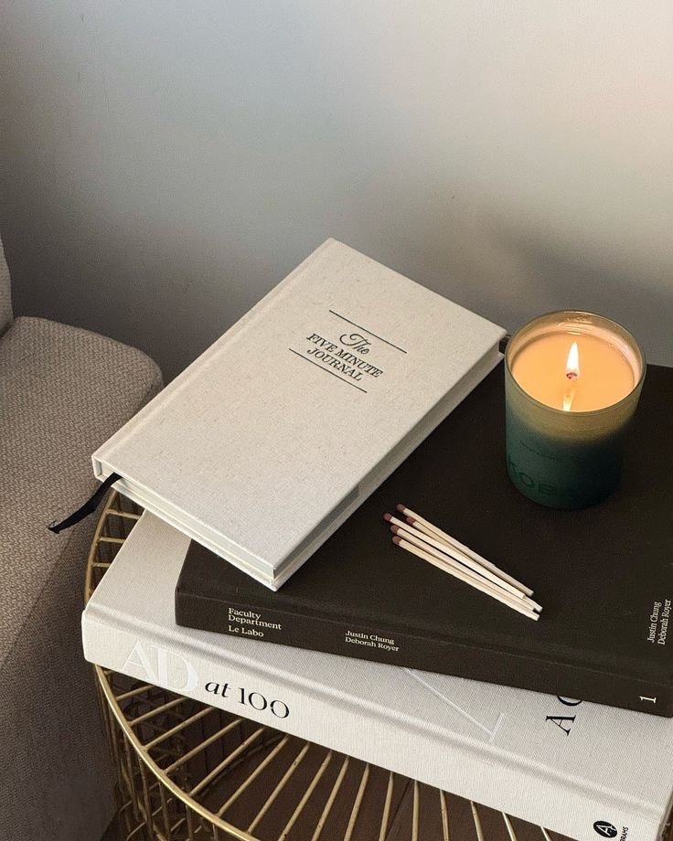 the five minute journal table set up with candle