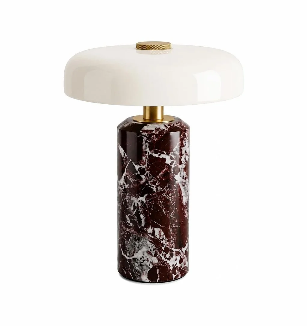 Marble and porcelain table lamp with a white shade and gold accents.