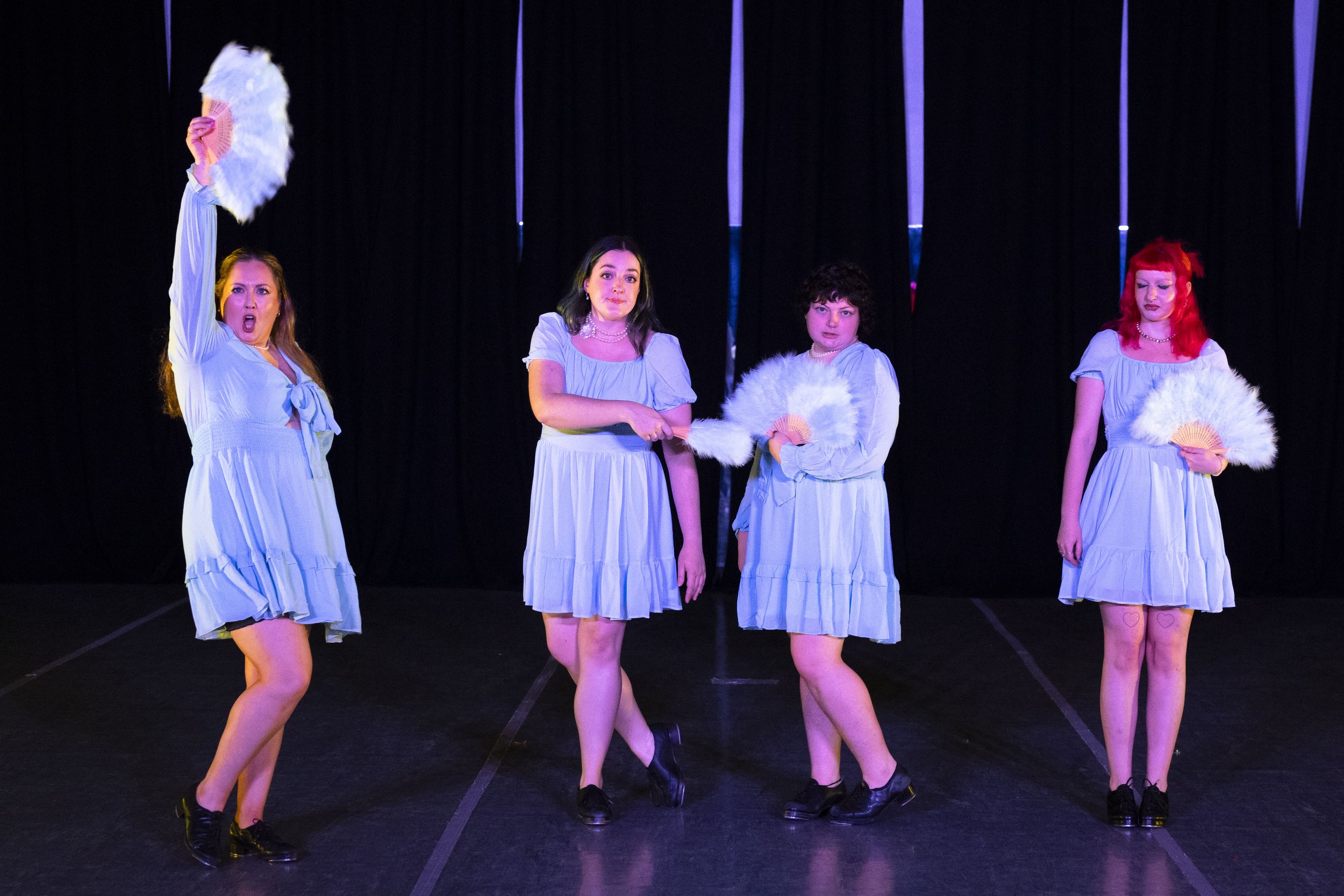 A group of four tap dancers, led by Caroline Vance,  perform at RECITAL. 