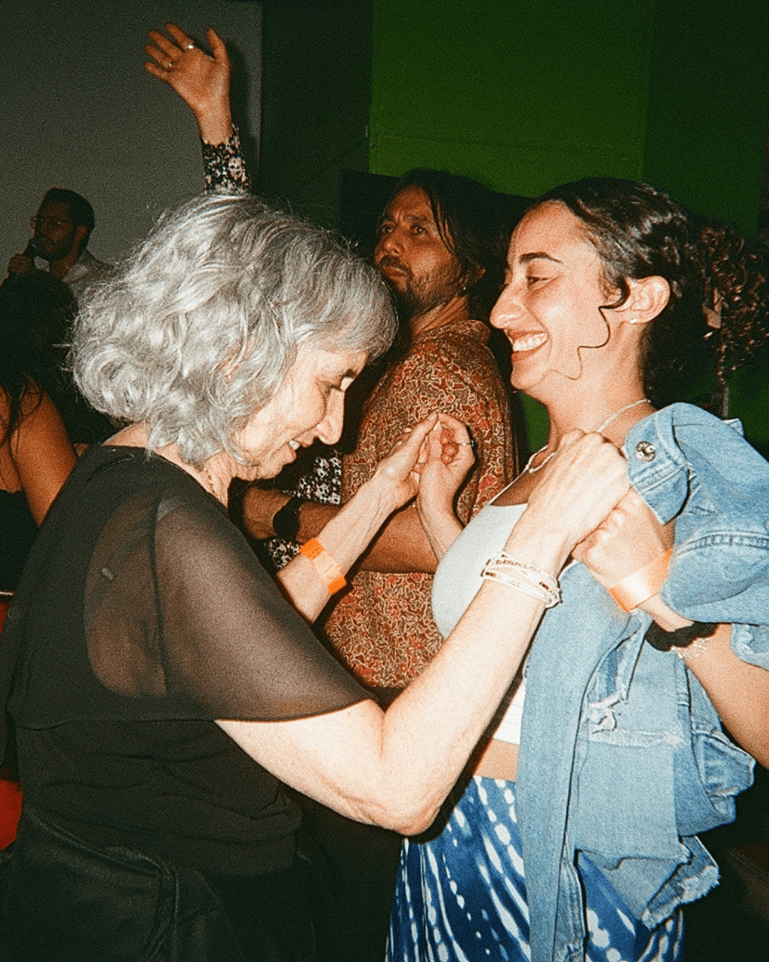 A mother and daughter dancing happily at Lolo's Social Club.