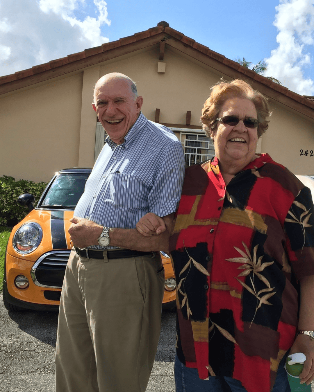 Lolo walking outside with his wife Eloisa Suarez in Miami, Florida.