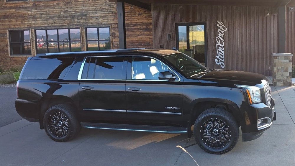 Black GMC Yukon XL Denali at the Stancraft private aviation terminal