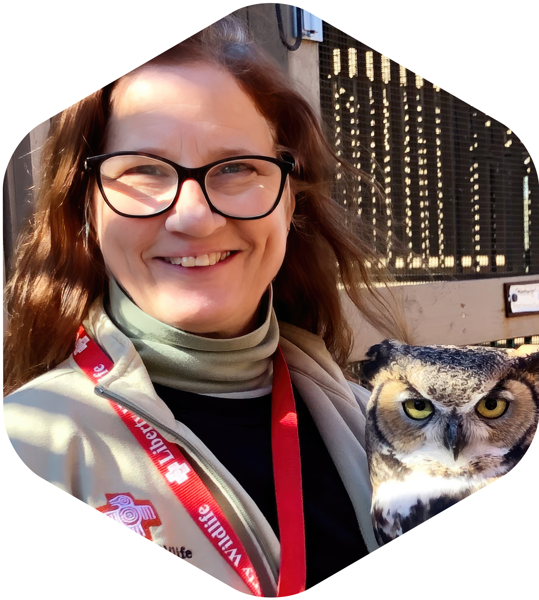 Image of Ceci Ellis and a Great horned Owl