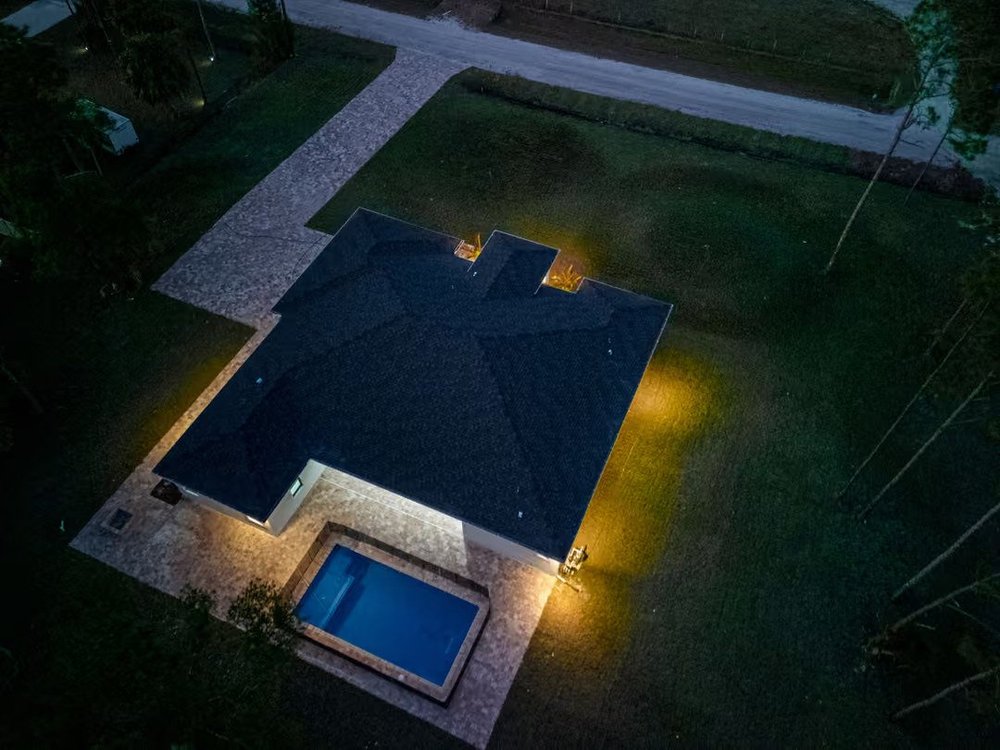 Pool and spa lit at night