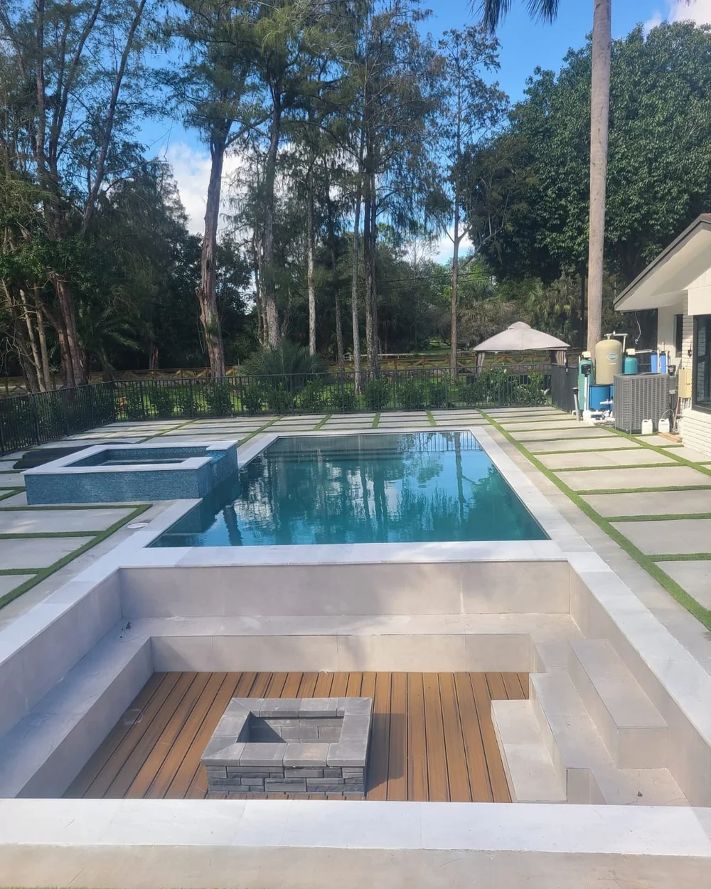 Modern pool with raised spa and sunken lounge