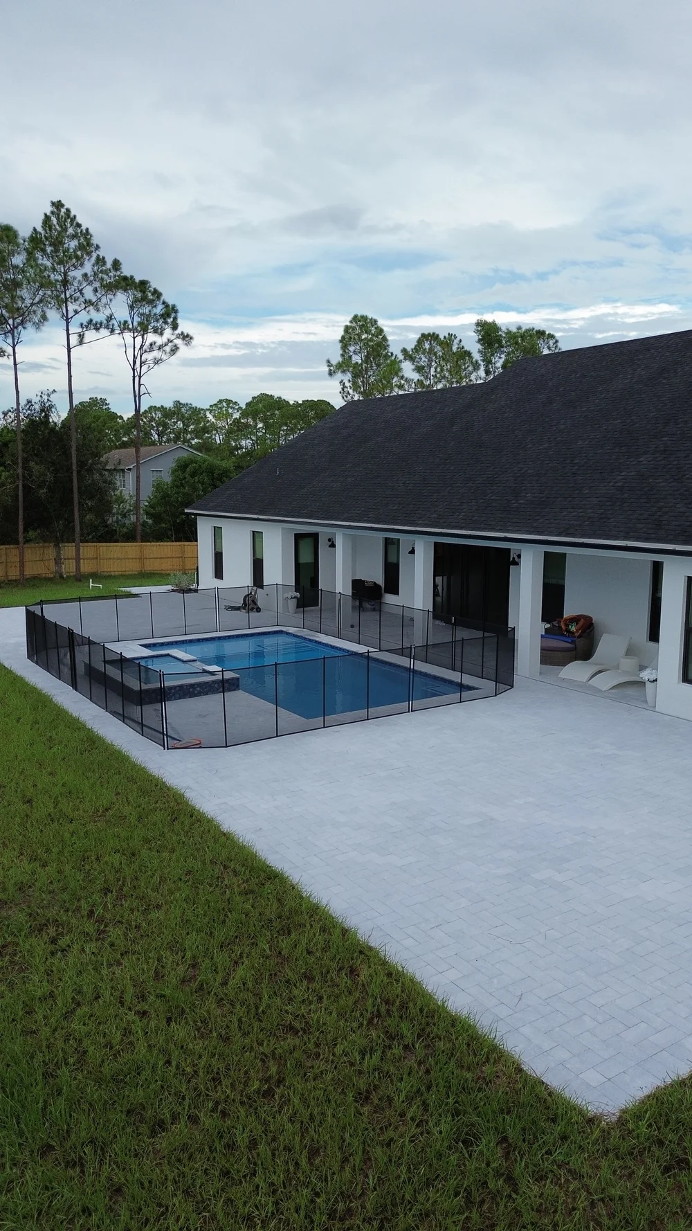 New pool and spa behind a new home