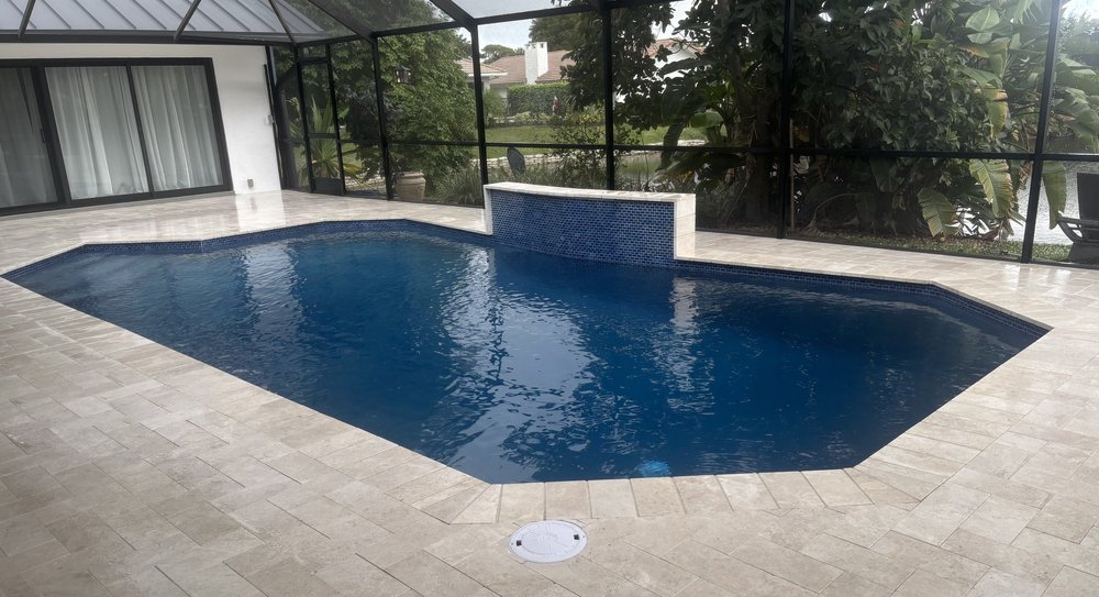 Screened pool with tiled water wall
