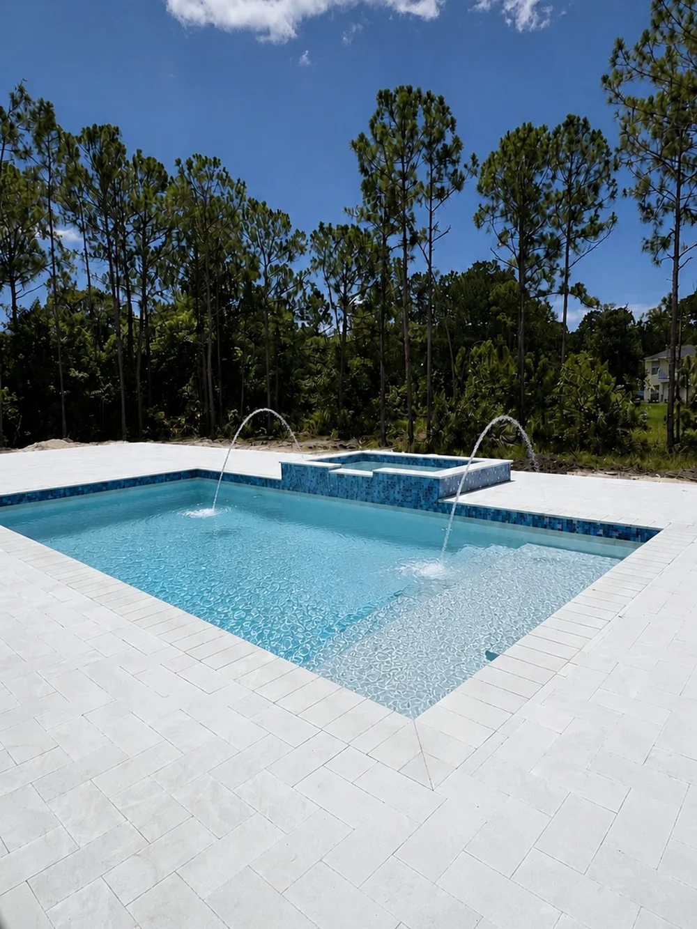Renovated pool with deck jets and raised spa