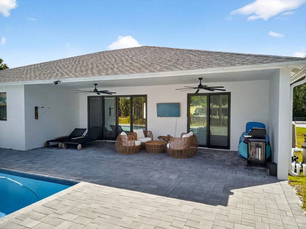 Pool off a covered lanai
