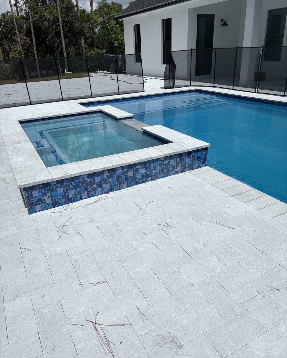 Spa with iridescent tile spillover