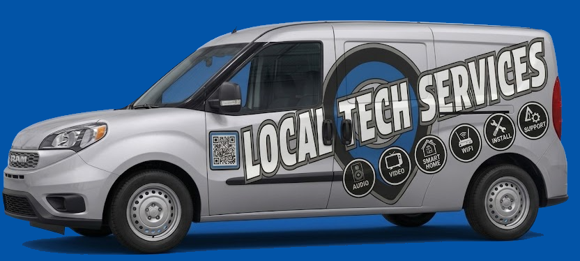 Silver delivery van with graphics advertising local tech services, including icons for audio, video, smart home, Wi-Fi, install support, and a QR code.