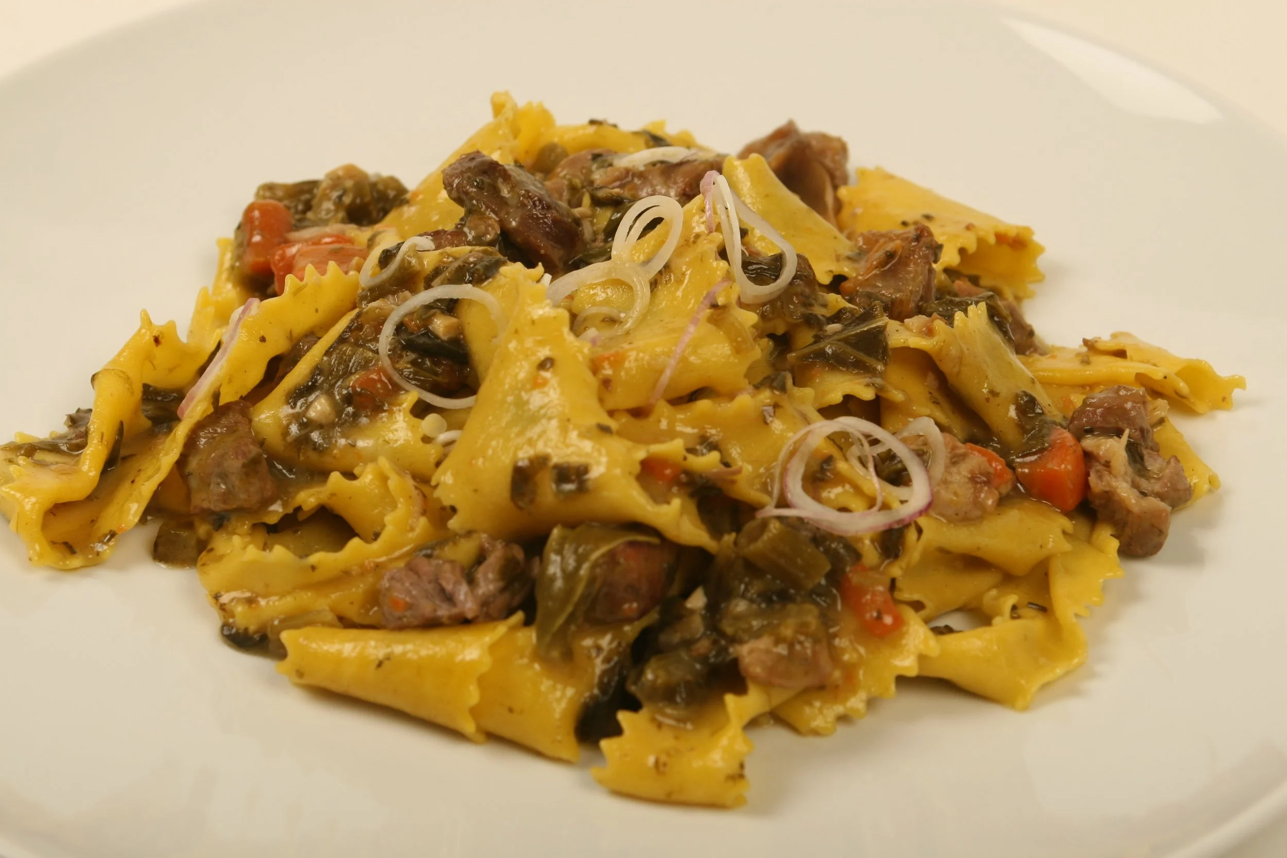 Pappardelle with Pork Ragù and Collard Greens.