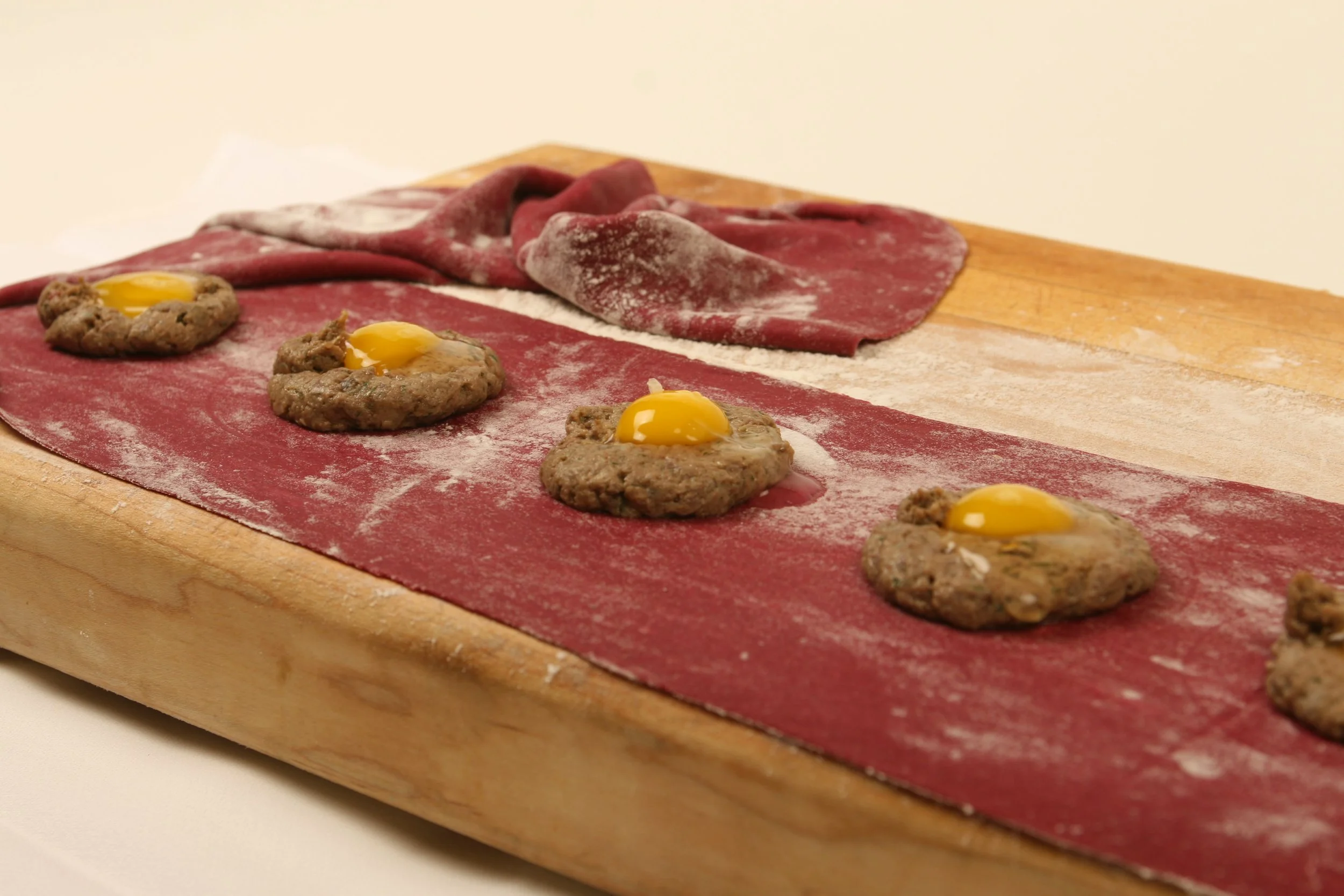 Uovo e Raviolo: Beet Pasta filled with Chicken Liver & Potato Farce and a Quail Egg.