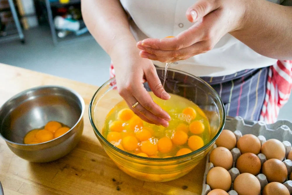 Isabella separating eggs for pasta making. 