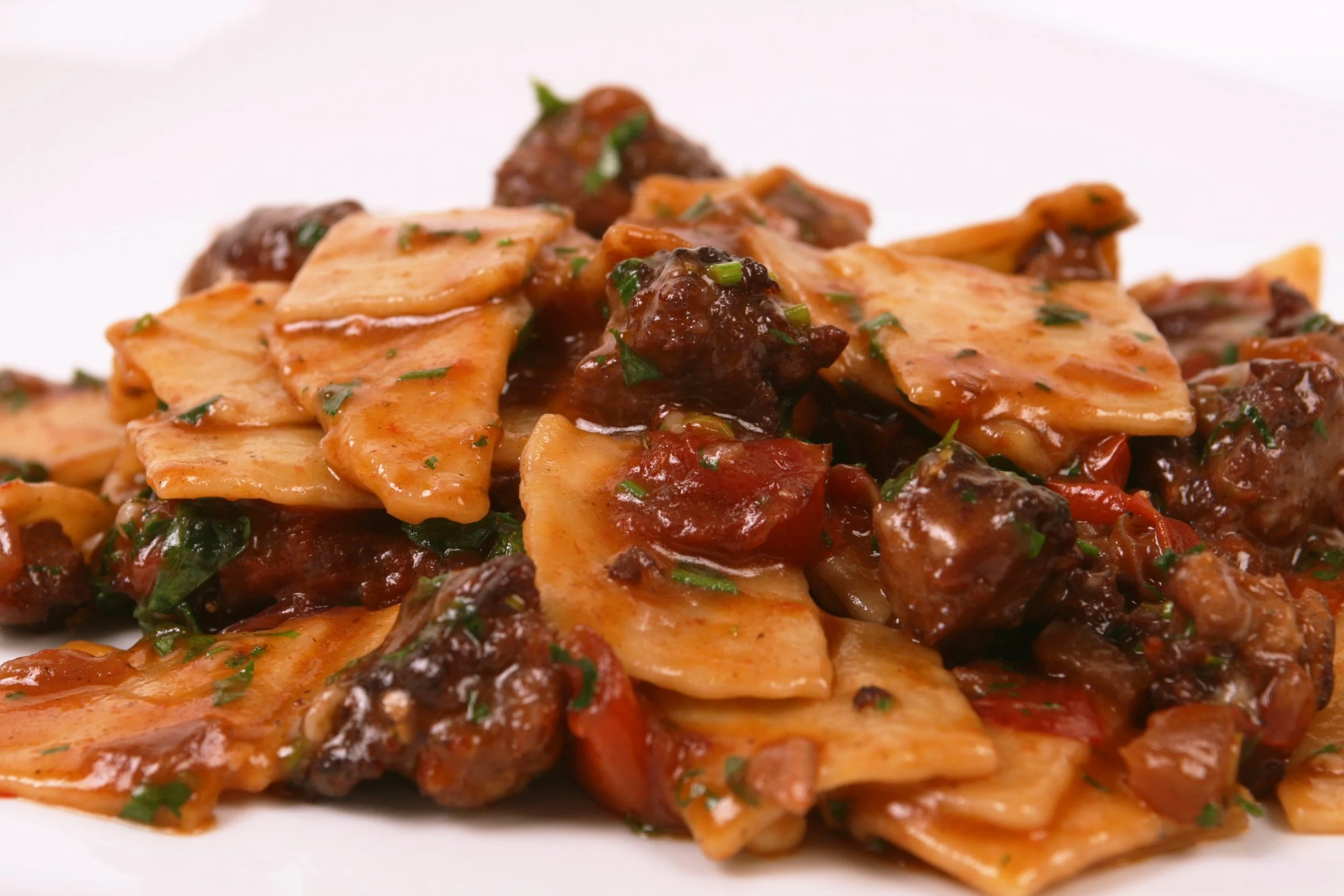 Cresc'Tajat with Sausage Ragù and Rosemary.