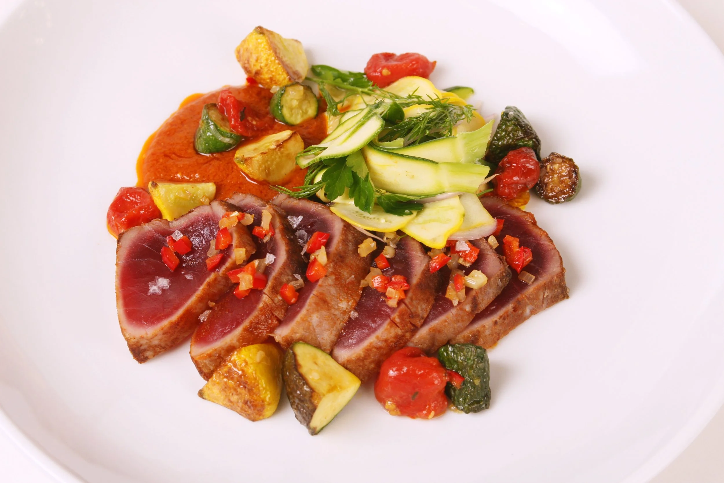 Seared Tuna with Roasted Tomato and Pepper Sauce, Roasted Summer Squash, Shaved Squash Salad, and Lemon EVOO.